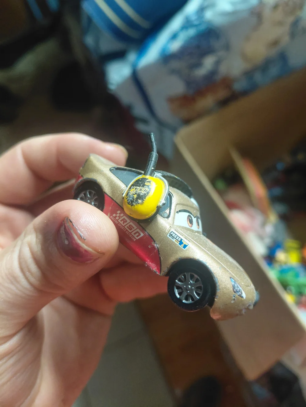 diecast toy is a 1:55 scale Mattel Disney Pixar Cars character named Shannon Spo